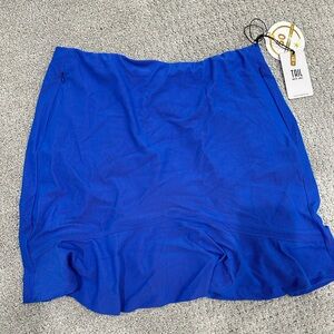 Blue Golf/Tennis Skirt. Has an Iridescent pink undertone. Size M. NWT